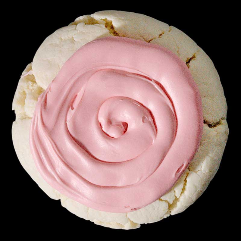 A sugar cookie with pink frosting